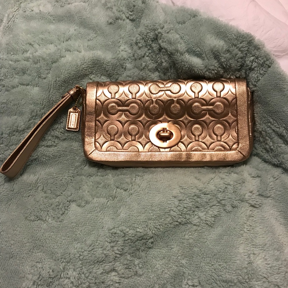 Coach rose gold clutch